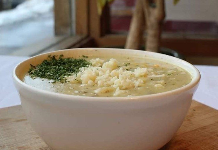 A bowl of Doc's white chili topped with fresh herbs